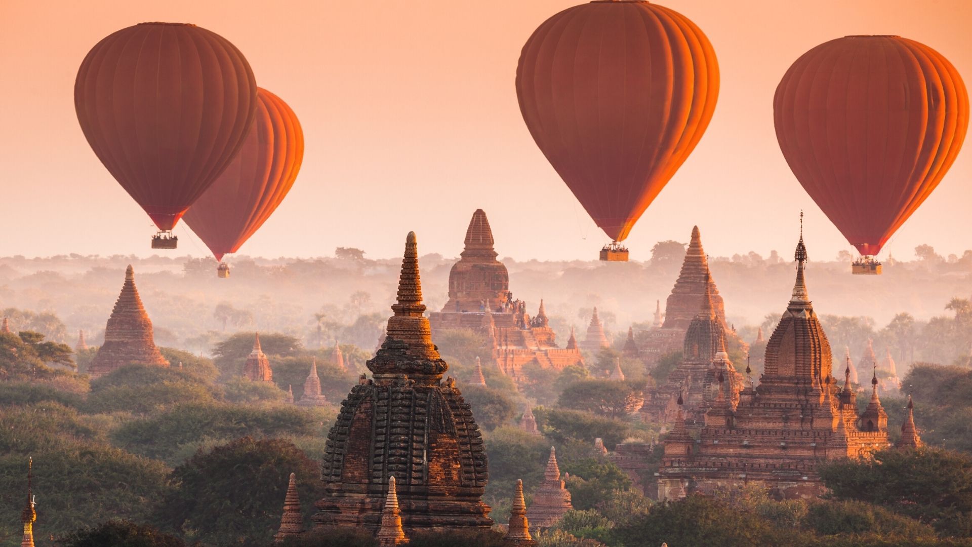 A photograph of Asia, lined with hot air balloons
